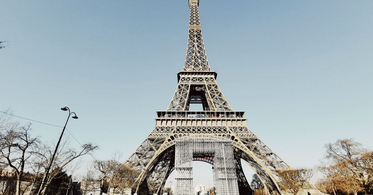 Climb the Eiffel Tower at dusk, Paris, France
