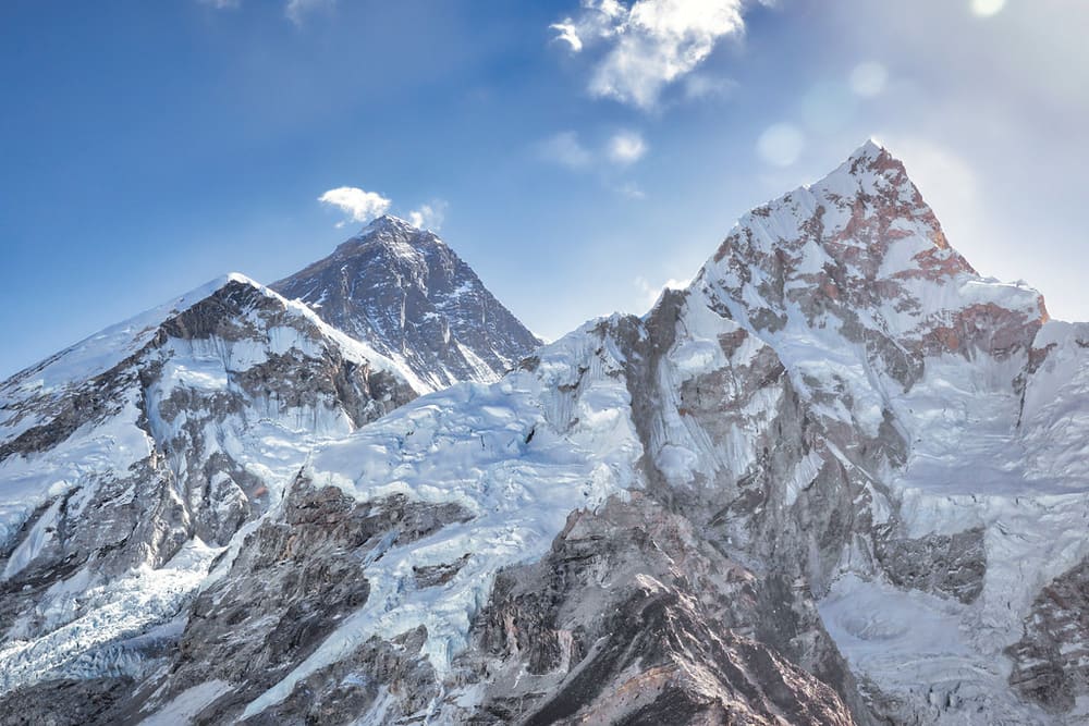 Mount Everest's dark summit pyramid behind the Nuptse ridge, Khumbu, Nepal