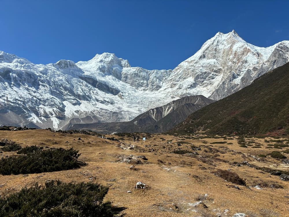 The snow-capped summit of Manaslu above a dry valley, Nepal