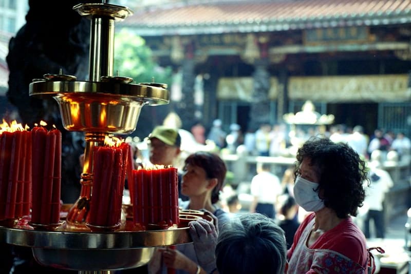 Stand in the incense at Longshan Temple, Taipei, Taiwan