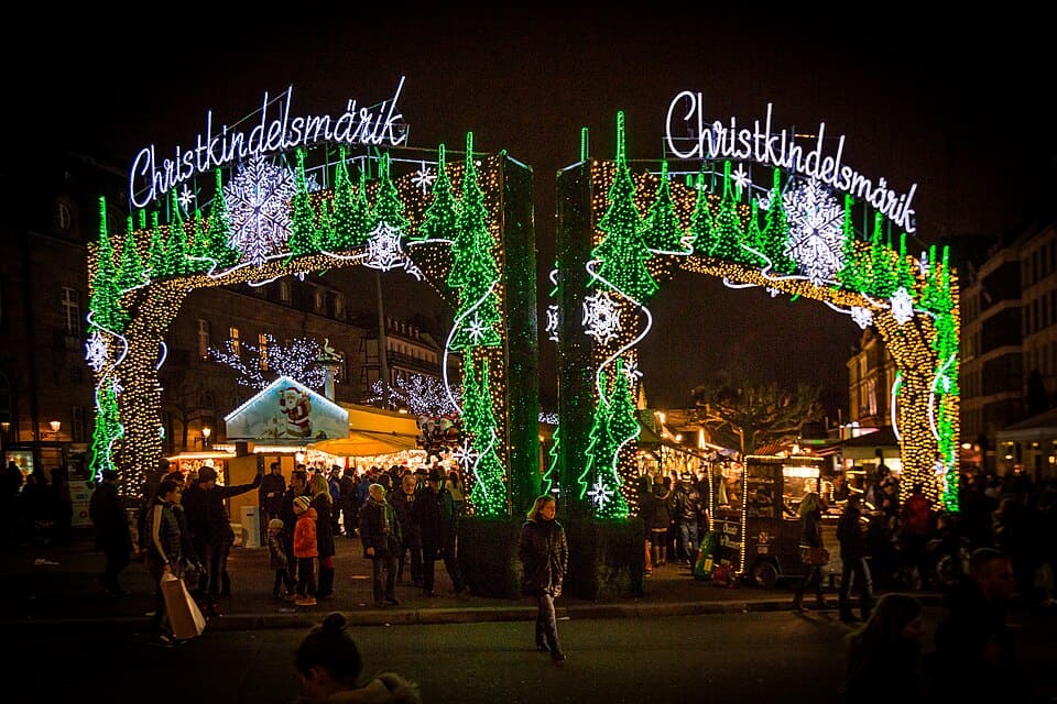 The lit Christkindelsmärik gateway at the Strasbourg Christmas market, France