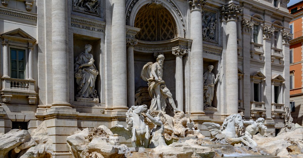 Toss a coin in the Trevi Fountain, Rome, Italy