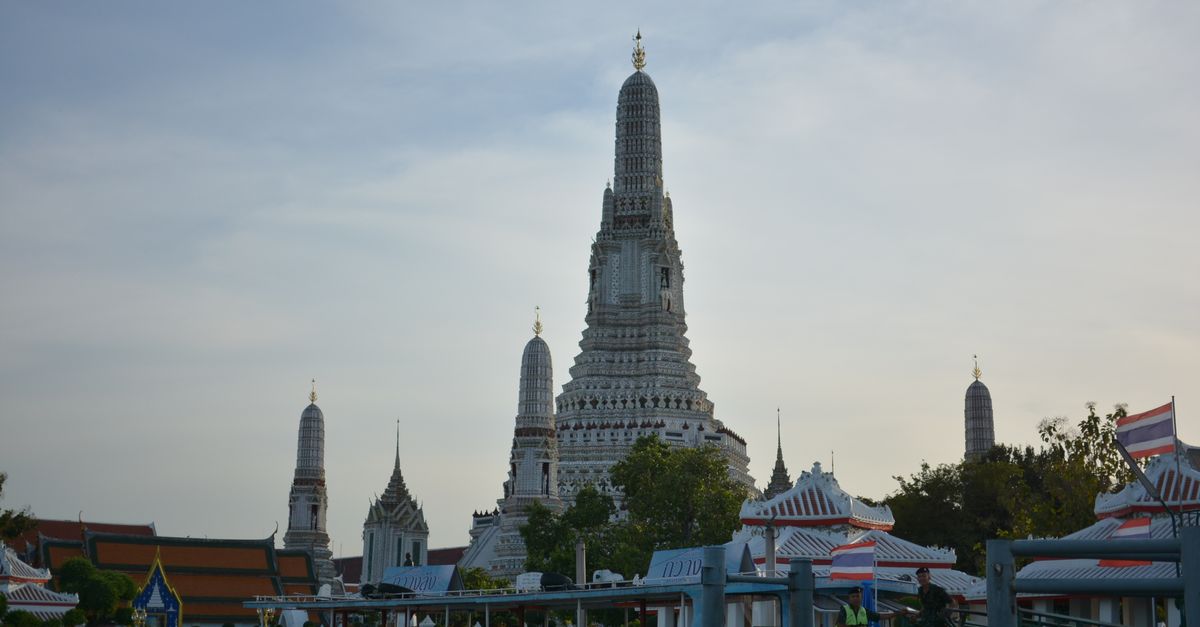 Climb Wat Arun at golden hour, Bangkok, Thailand